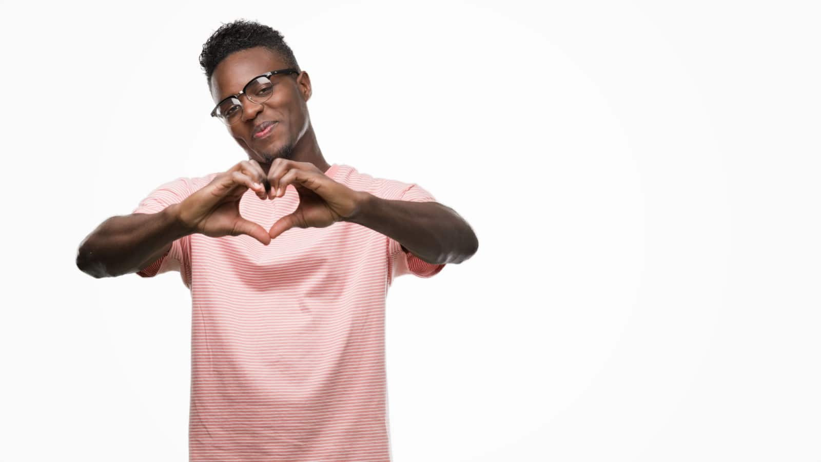 Black man making heart