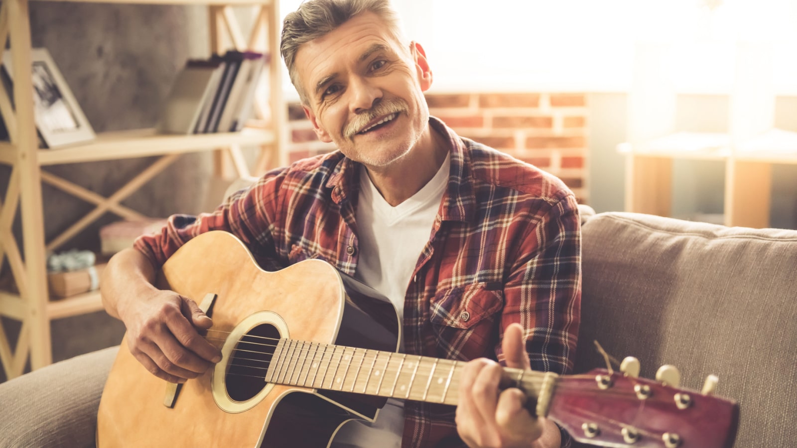 older man playing guitar