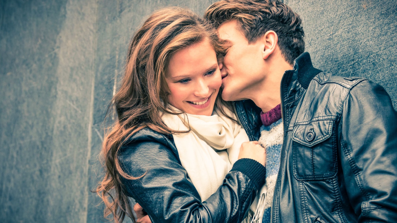 man smelling woman