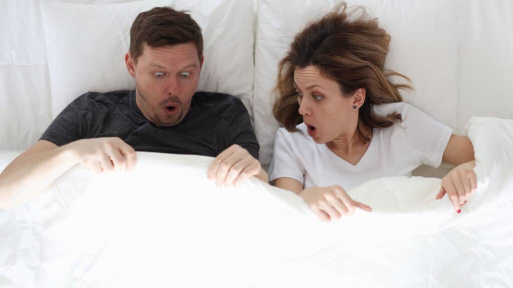 man and woman in bed